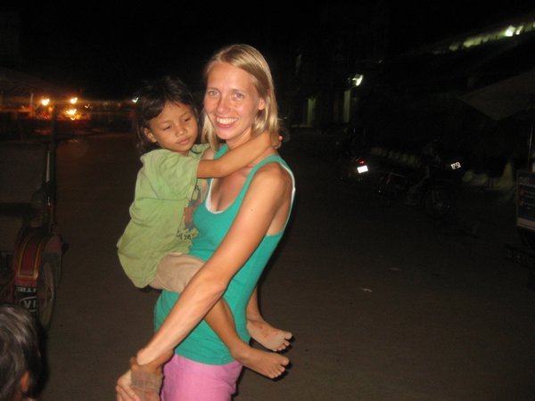 130. A Cambodian girl attaches herself to Trudi, Siem Reap