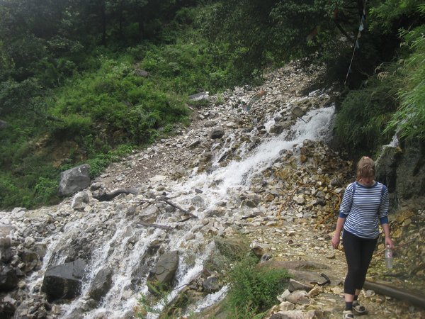 35. Crossing the path of a waterfall as we walk along Tiger Leaping Gorge