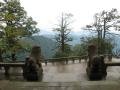 27. Two guardians look out on to the Emei Shan mountain range