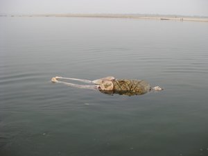 25. A dead body floats down the Ganges, Varanasi