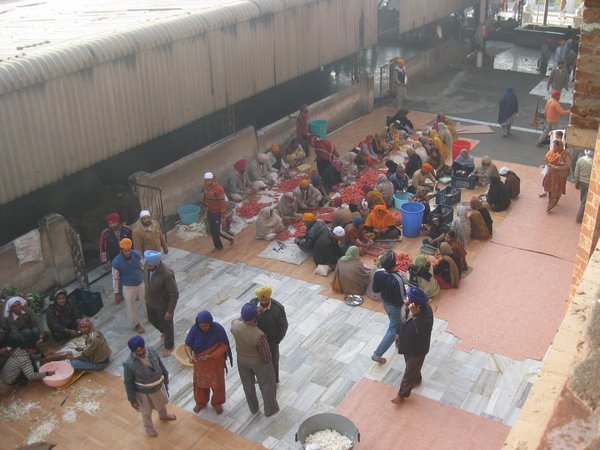 1. Volunteers cutting carrots outside the langar, Amritsar