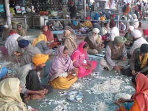 20. Volunteers peel garlic outside the langar, Amritsar