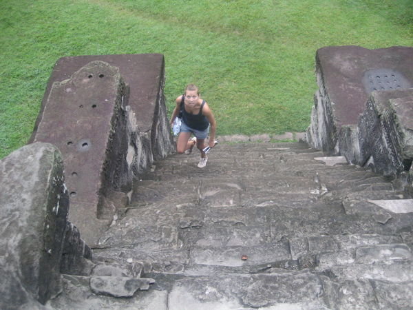 Climbing stairs to the third level of Angkor Wat