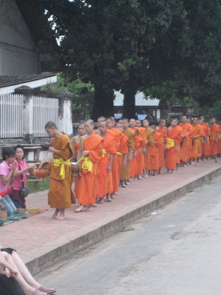 The line of monks receiving alms