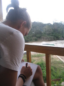 Writing in my journal on the porch of our hostel