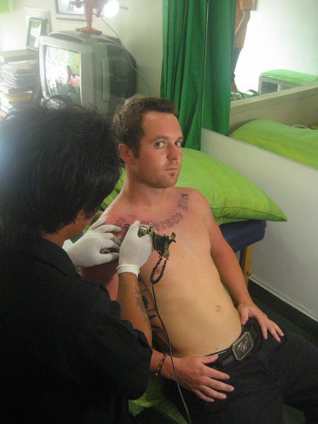 Chris getting his new tattoo