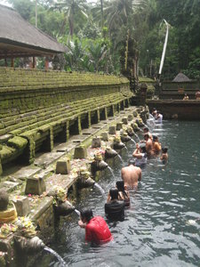 People bathing at Tirta Empul