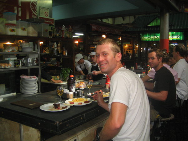 Eating steak at the Mercado in Montevideo