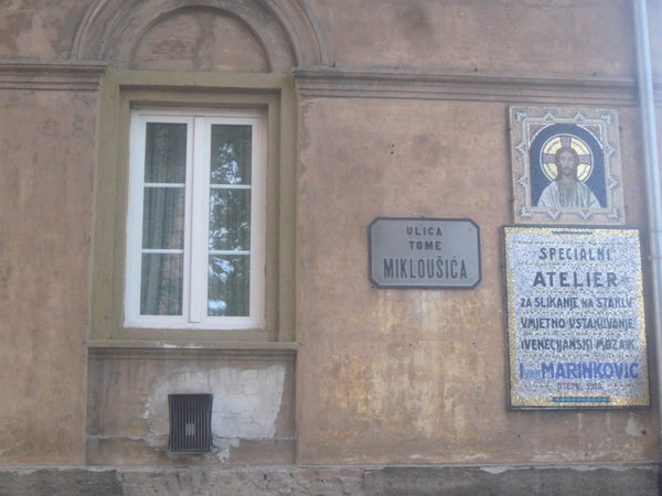 Street sign and mosaic