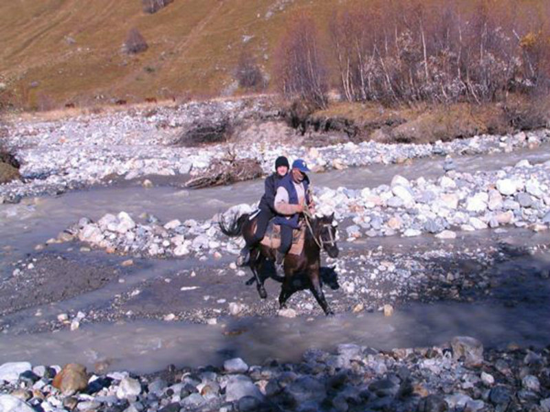 Crossing the Adishi river by horse