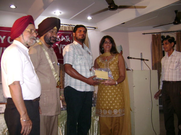 Giving Teacher Award To Mr. Sharma