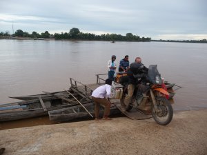 Crossing the Mekong on 3 longtail boats