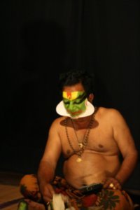 Kathakali Artist with the Paper Added onto Face