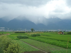 Farms, City, and Mountains