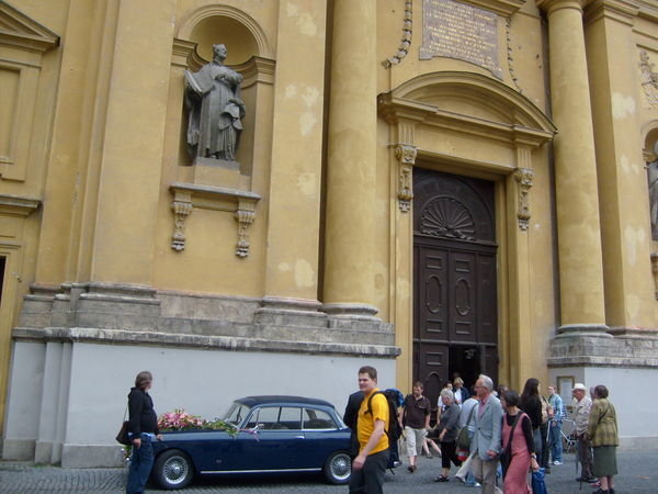 What appeared to be a fancy old car in front of a church