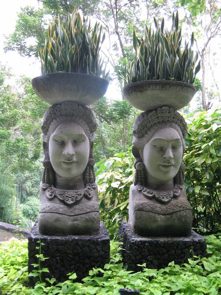 A pair of planter sculptures along the side of a road