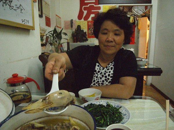 Mei Ling offering me the best in the pot