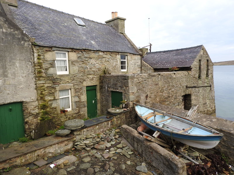 fisherman's cottage built into the harbour sea