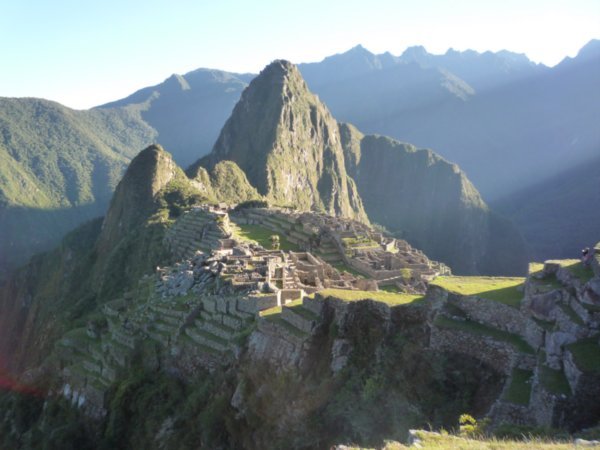 The sun rises over Machu Picchu