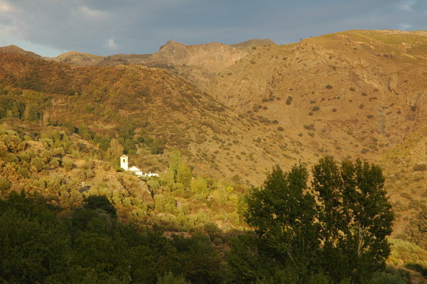 A church on the hillside at dusk