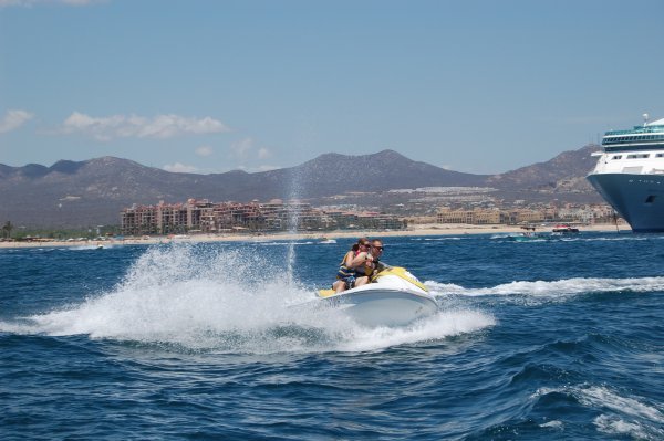 Jet skiers with Royal Caribbean in background