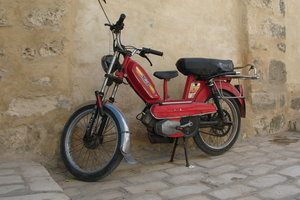 A motorbike with a little seat for the kids