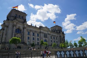 Reichstag in Berlin with white crosses to remember the ones who died at the Berlin wall