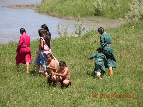 Women and children gathering wild vegetables