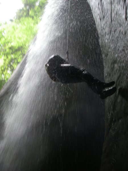 repelling through a waterfall