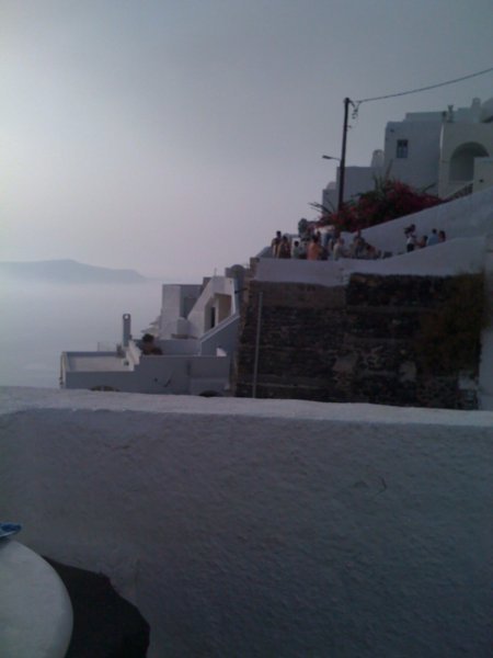 Wedding across the cliff from our balcony in Fira