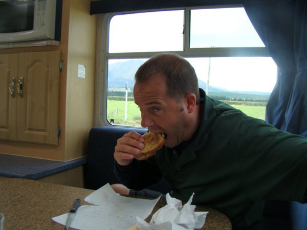 Tim eating in the campervan