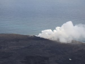 Steam from lava hitting ocean