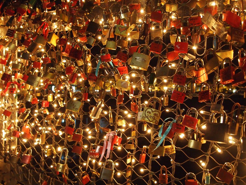 Love lock bridge lit up at night