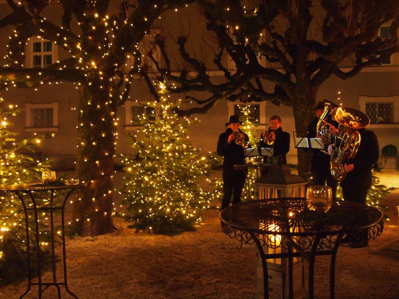 Brass quartet under Christmas lights