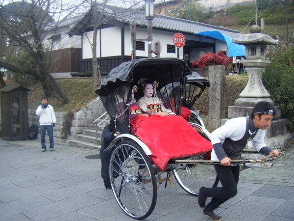 Geisha, or Maiko, in a rickshaw