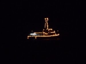One of the gunboats lit up at night