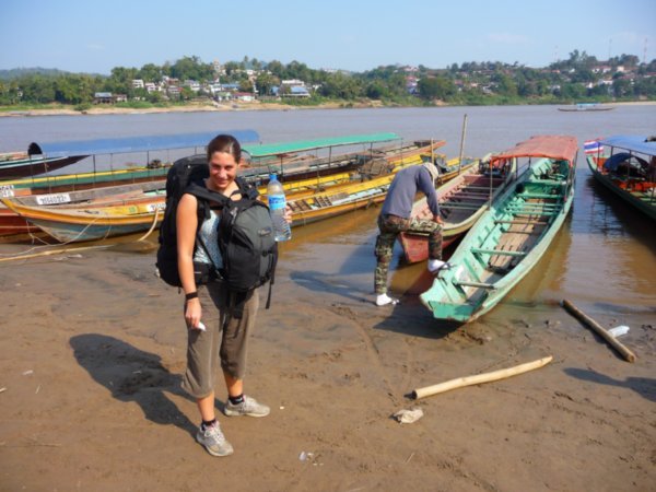 Standing at the edge of the Mekong River in Chiang Khong, about to cross into Laos
