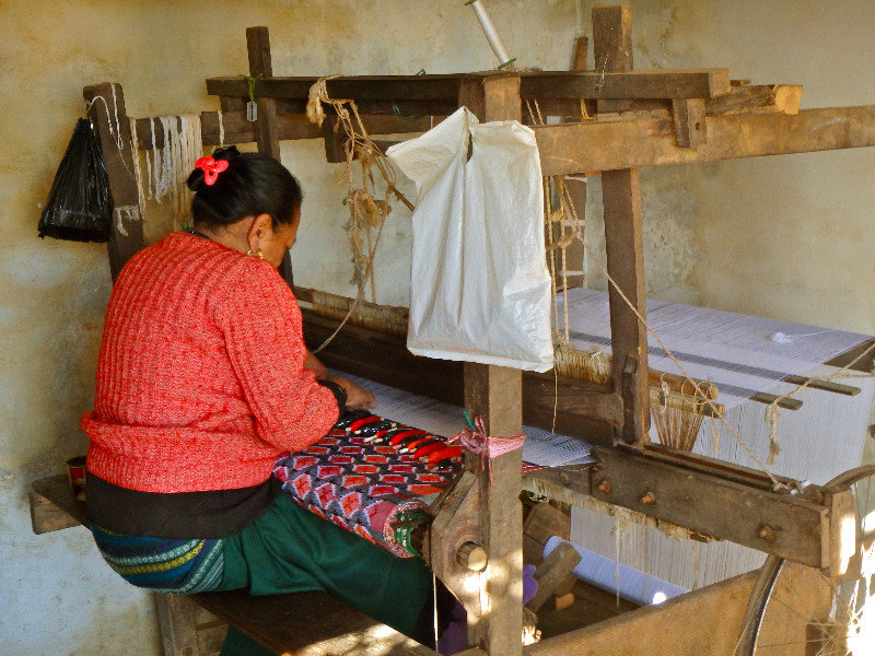 Woman working at her loom