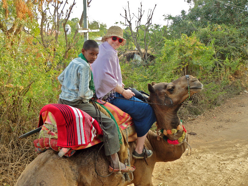 Maddy on a camel, with her underaged camel jockey