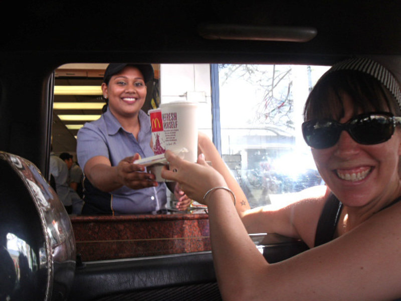 Elke going through a McDonalds Drive-Thru, in the back of a taxi, Fiji