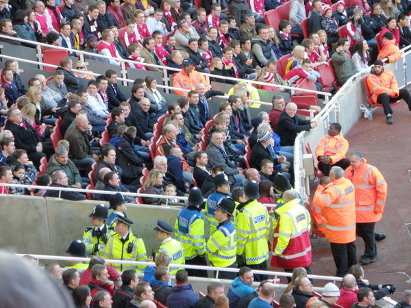 Security and Police watch the die hard fans