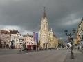 Church in main street of Novi Sad with storm approaching