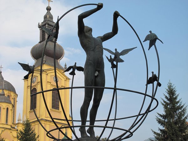 Statue symbolising putting a broken world back together