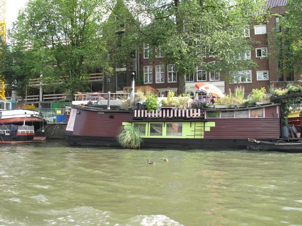 Houseboat on Amsterdams canal complete with garden