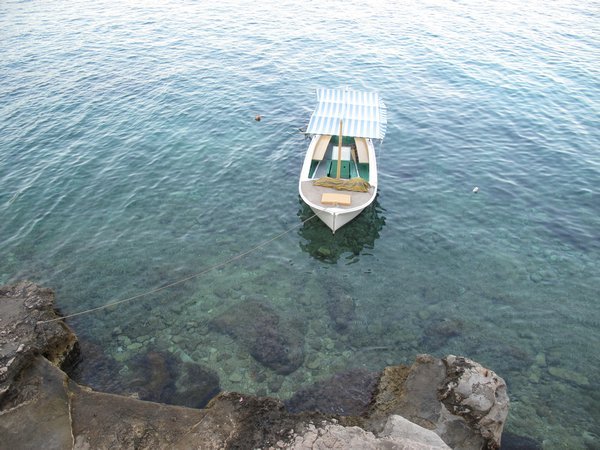 Small boat, clear waters
