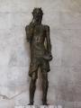 A long fingured statue of John the Baptist