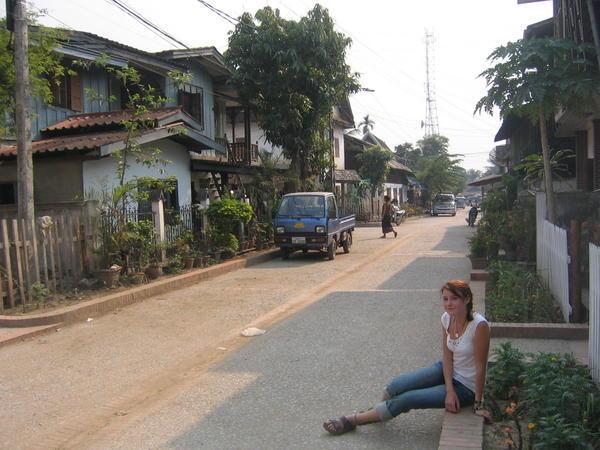 srah chilling on the curb in luuuang prabang