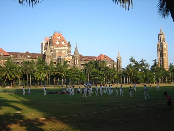 A cricket match outside the university...