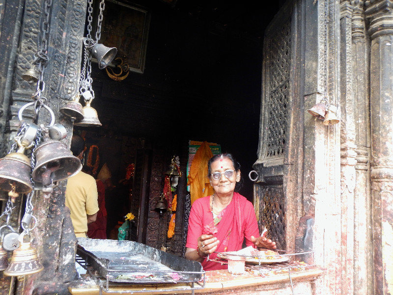 A Hindu Lady working at the Temple