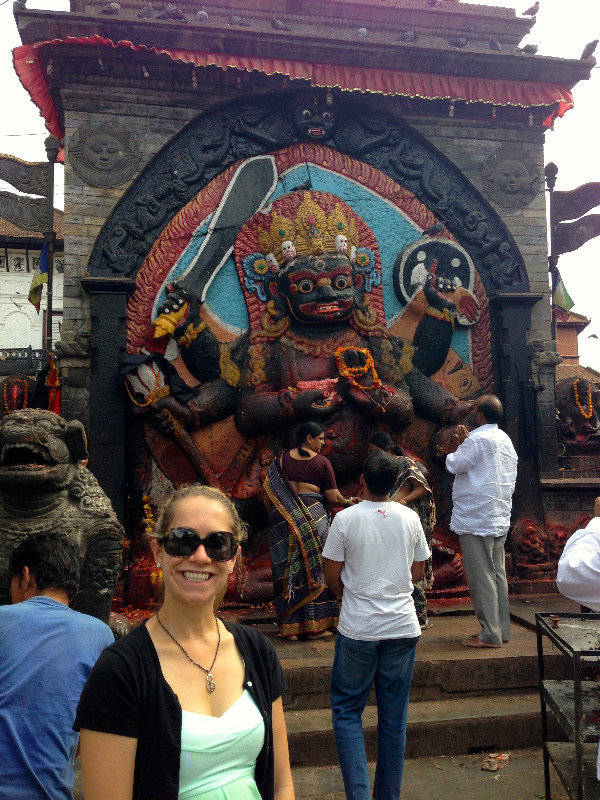 Elysia in front of a tribute to Shiva (God of Destruction) in Kathmandu's Durbar Square